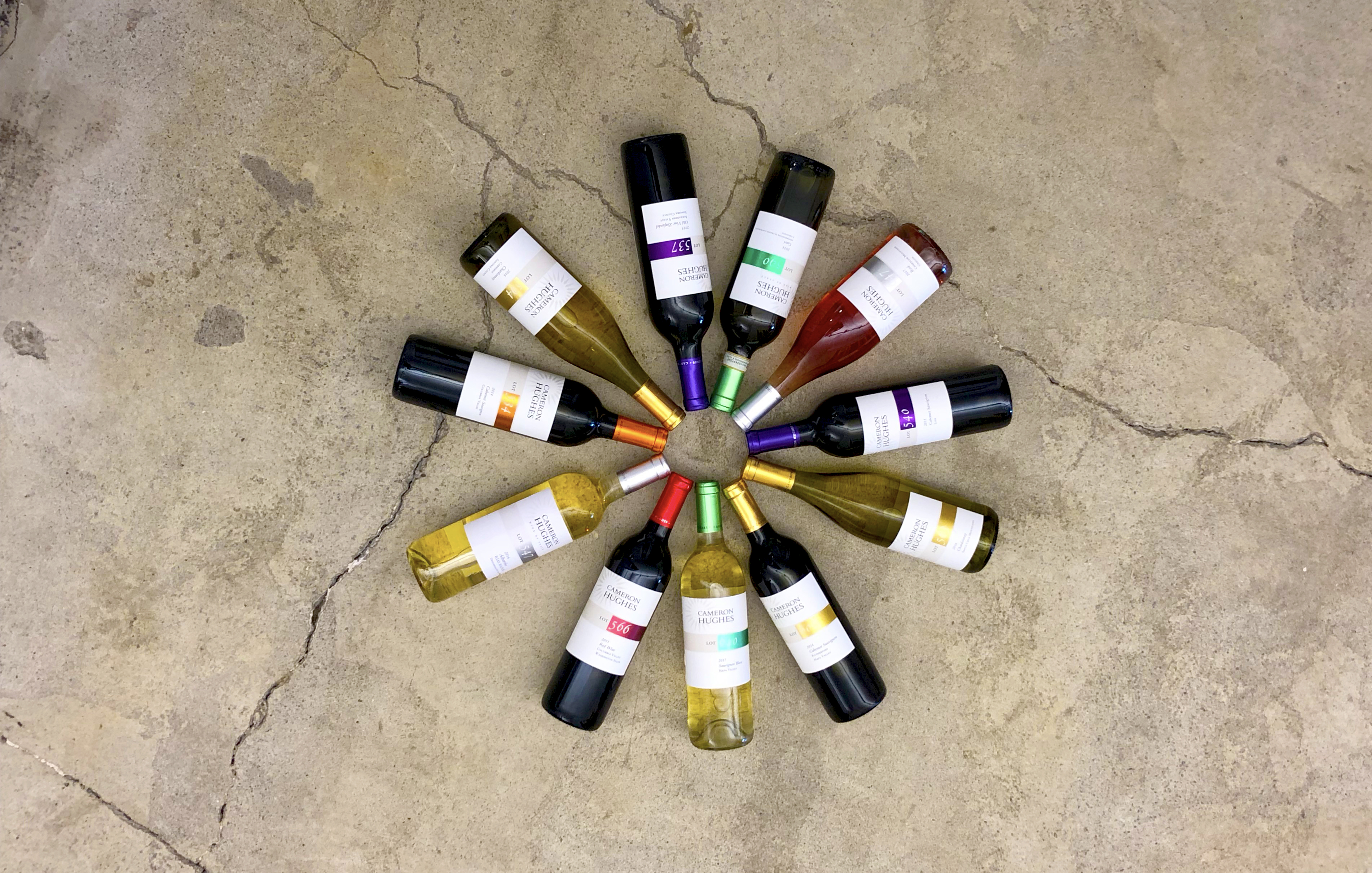 Image showing 12 bottles with their tops connected making a colorful and delicious circle