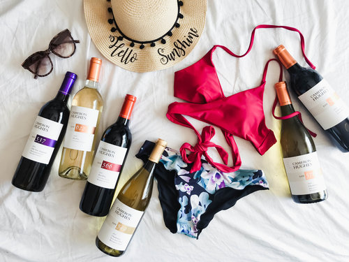 Image showing wine bottles and clothing for a great day at the beach