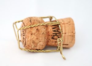 Champagne cork with brass-colored cage