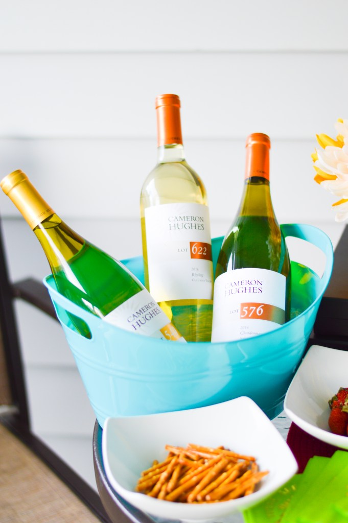 Three bottles of Cameron Hughes Wine white wines paired with party snacks