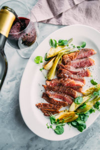Wagyu Steak and fresh vegetables paired with Cameron Hughes Wine