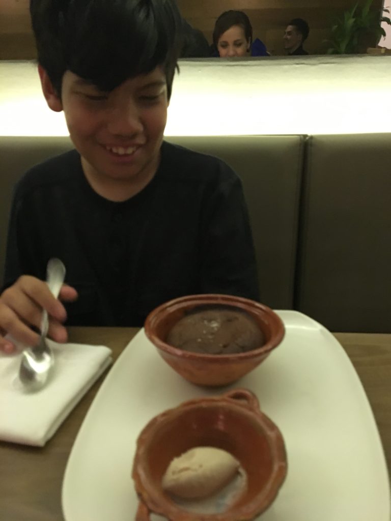 Diego enjoying dessert