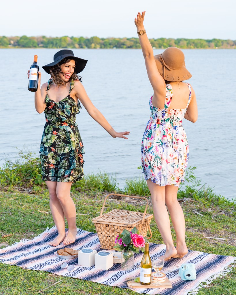 Two female friends celebrating their enjoyment of wine