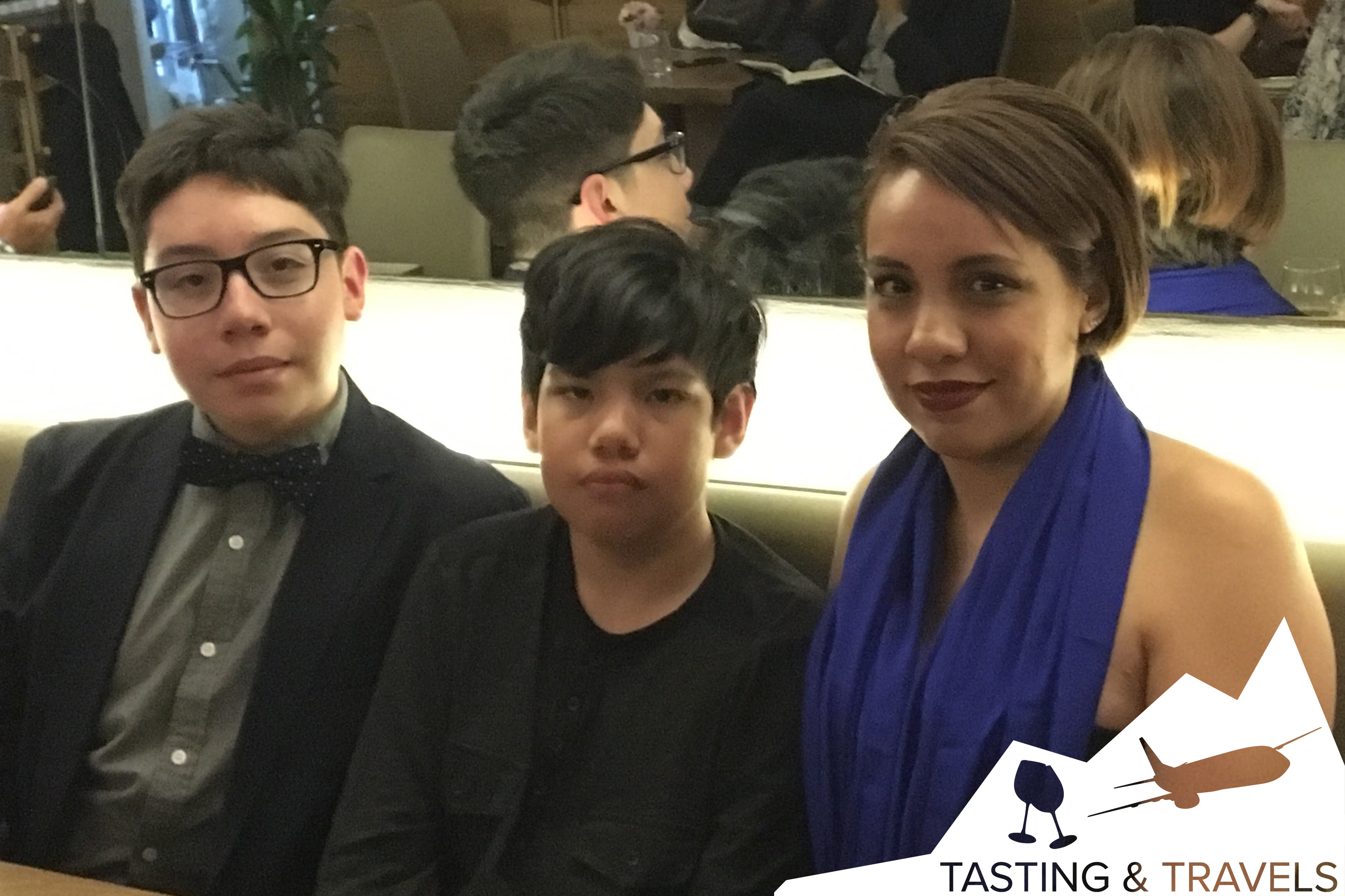 Three Mexican citizens seated in a room tasting wine