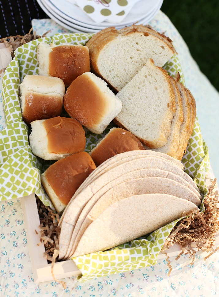 Bread basket with rolls, wraps, and sliced breads perfect for DIY sandwich station