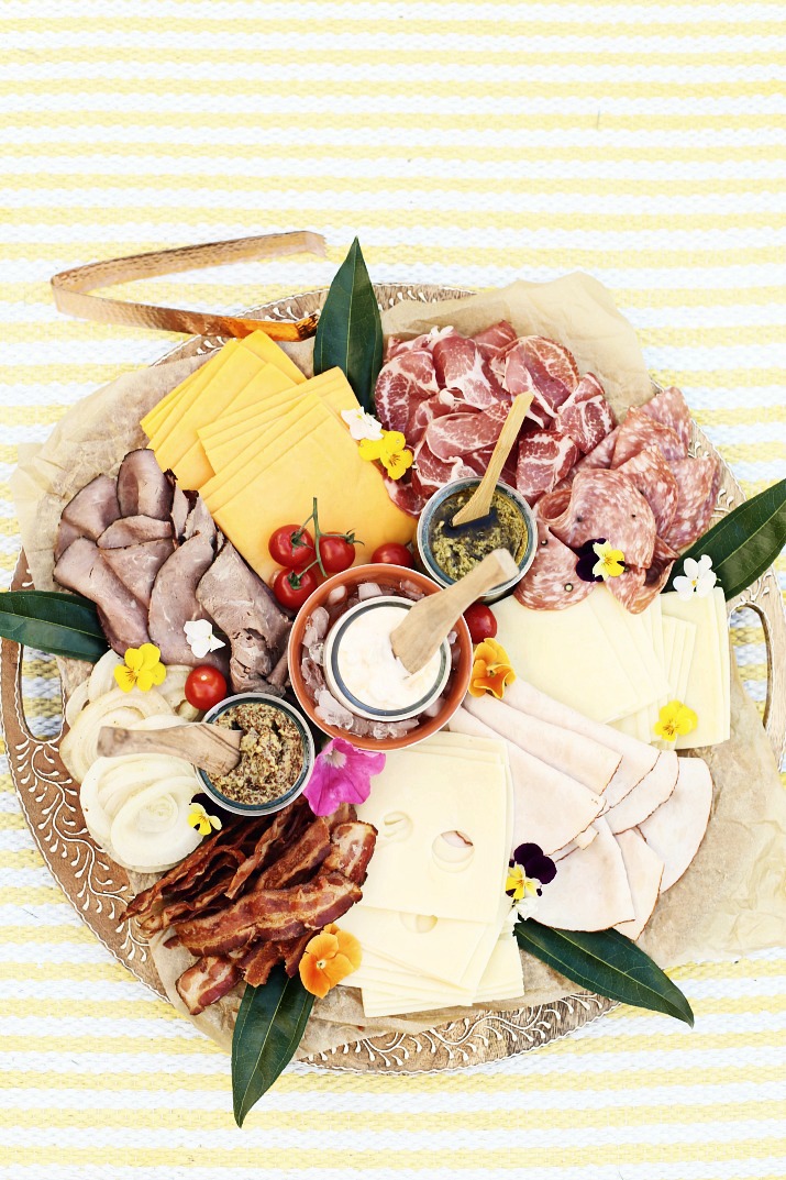 DIY sandwich tray with meats, cheeses, and condiments
