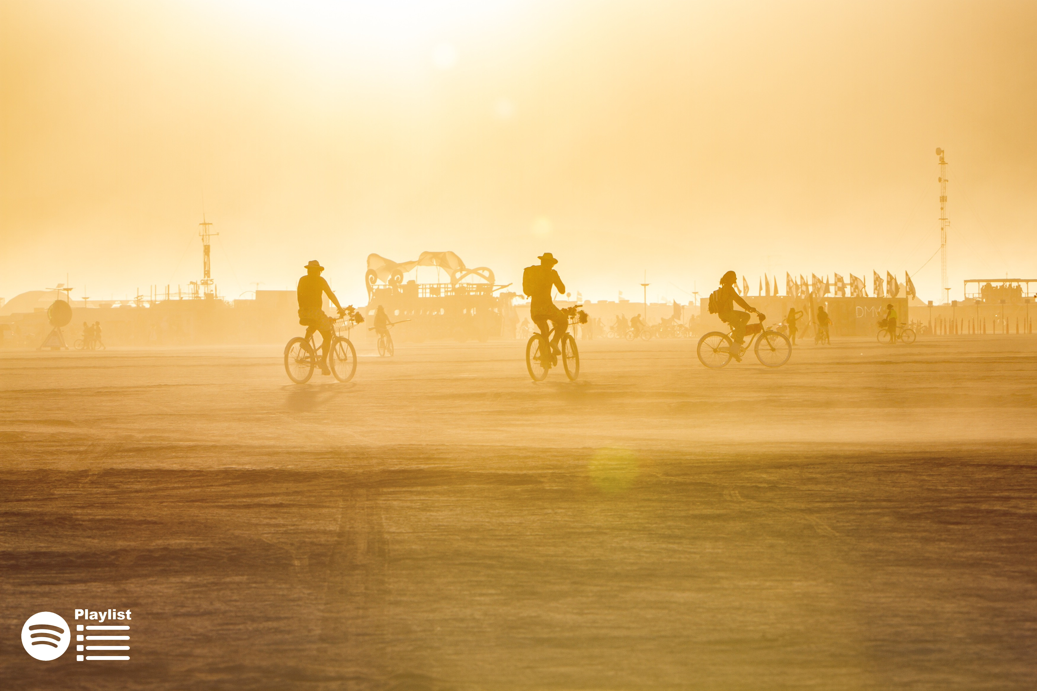 A scene from Burning Man with friends riding bicycles through the desert