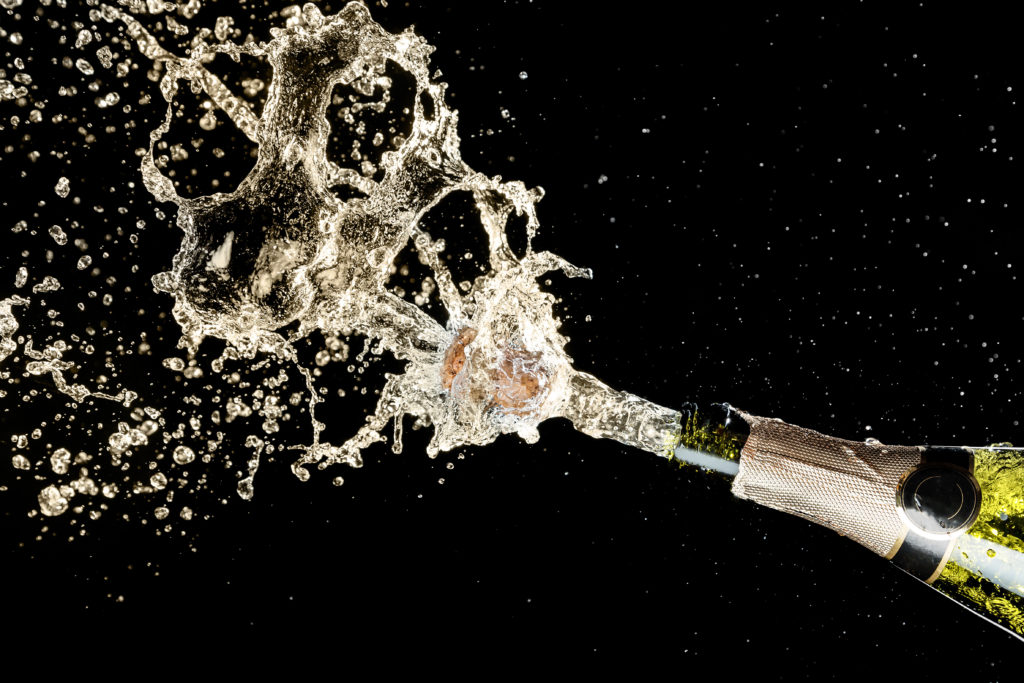A bottle of Champagne or sparkling wine exploding
