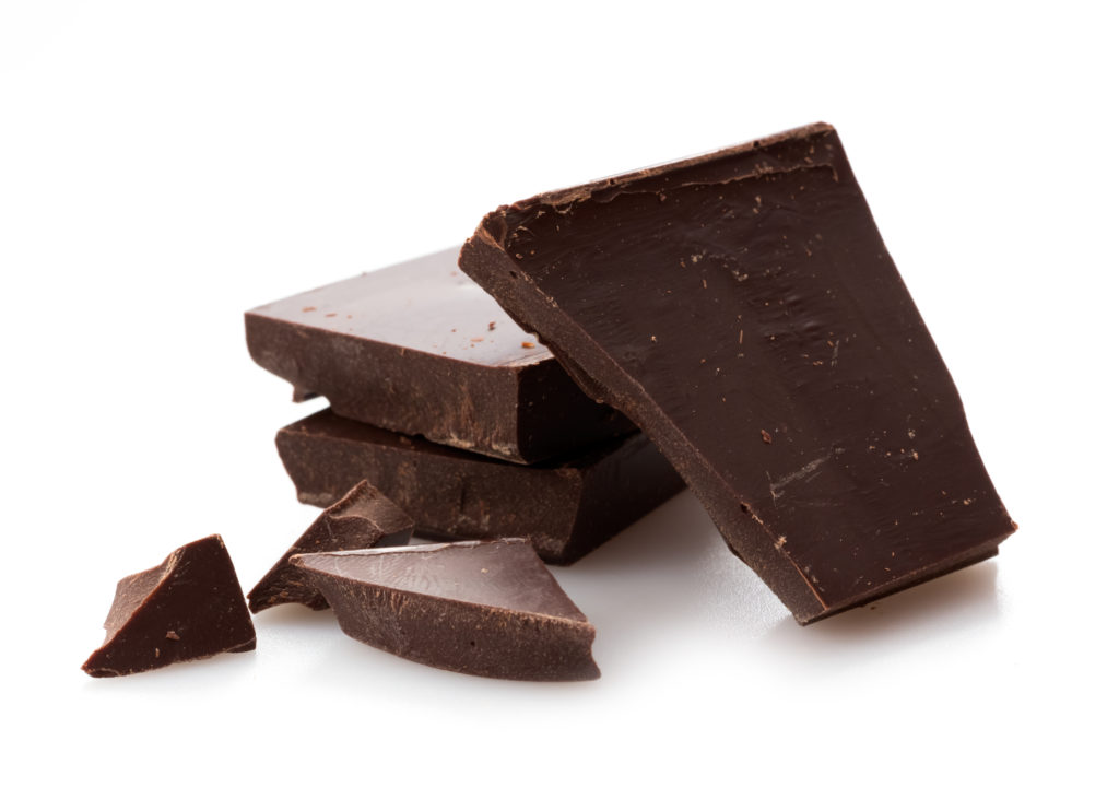 A block of chocolate broken into jagged pieces