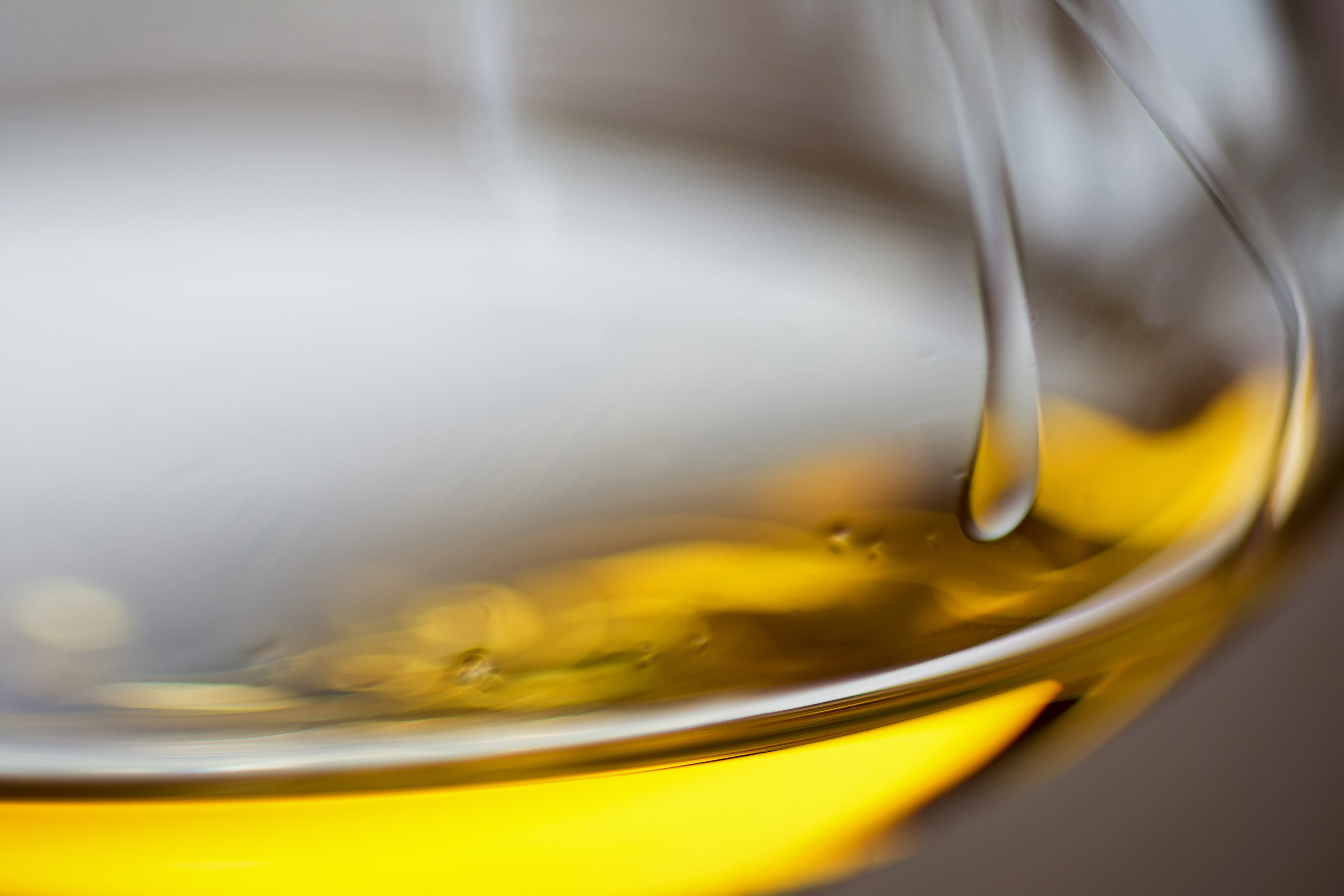Glass of Fume Blanc wine close up with a golden hue