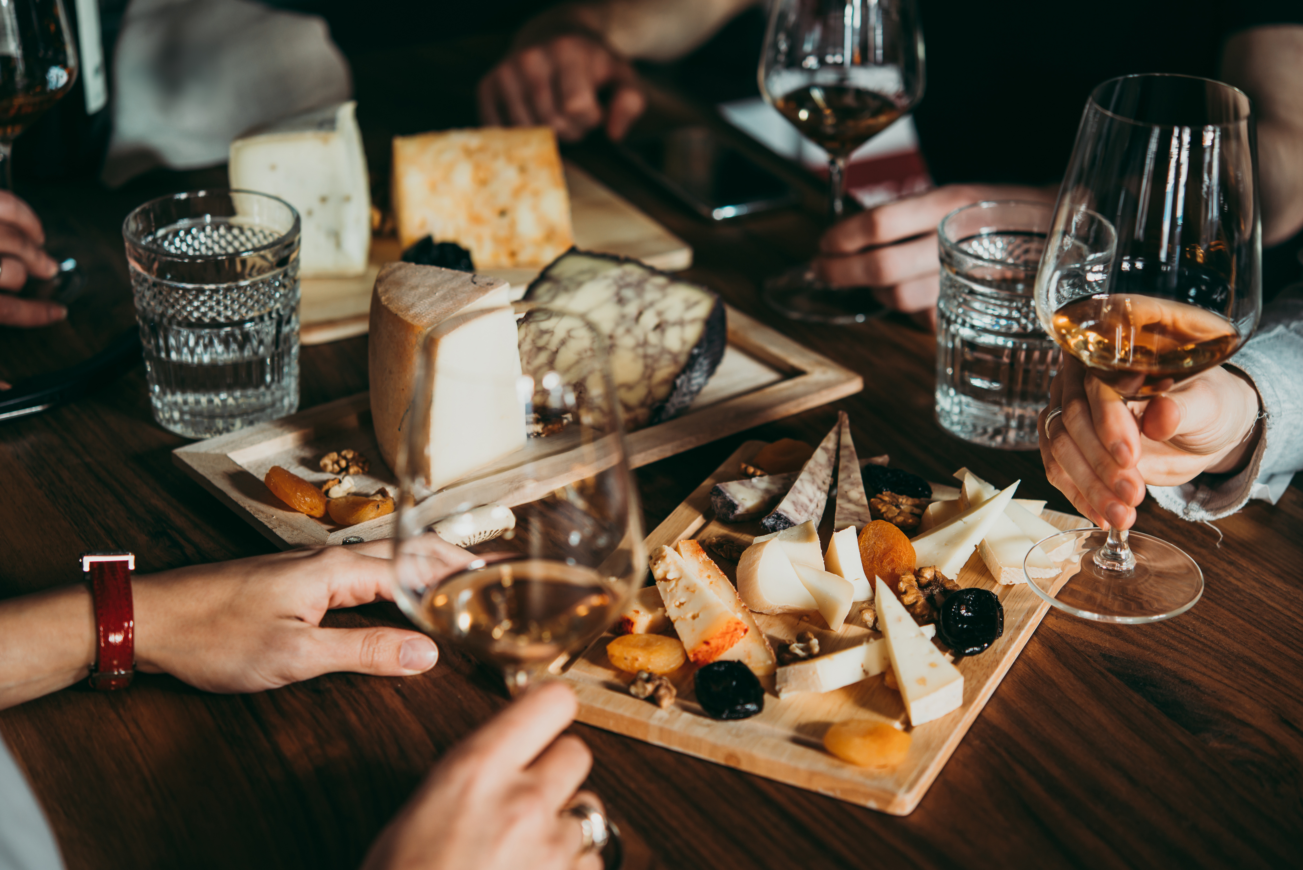 Wine and cheese served for a friendly party in a bar or a restaurant