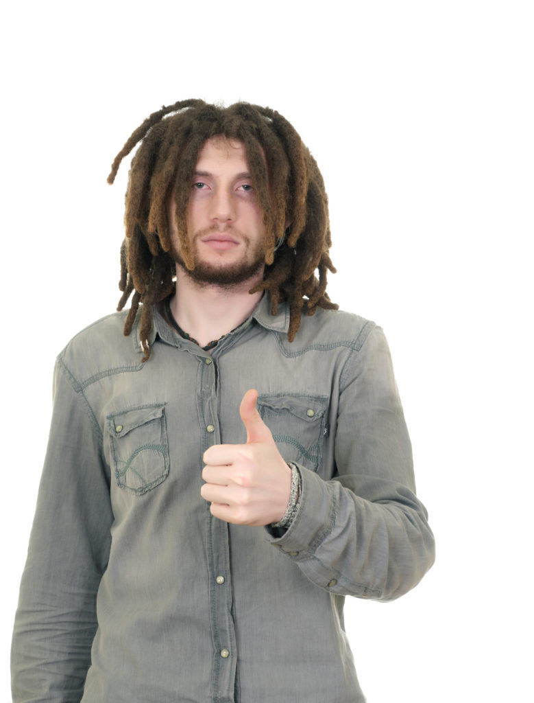 Hippie man with long dreadlocks holding his thumb up