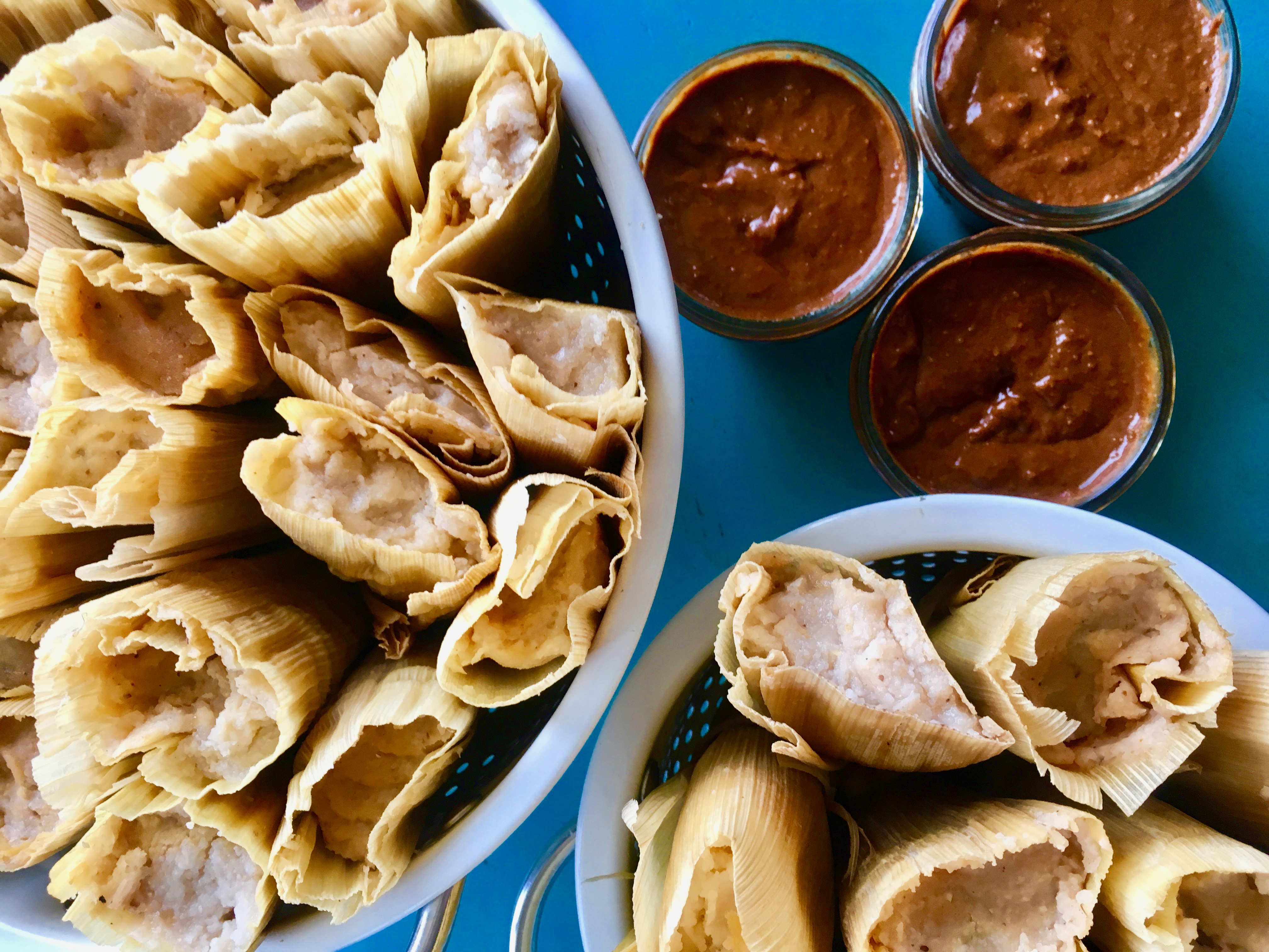 Tamales with varying dipping sauces