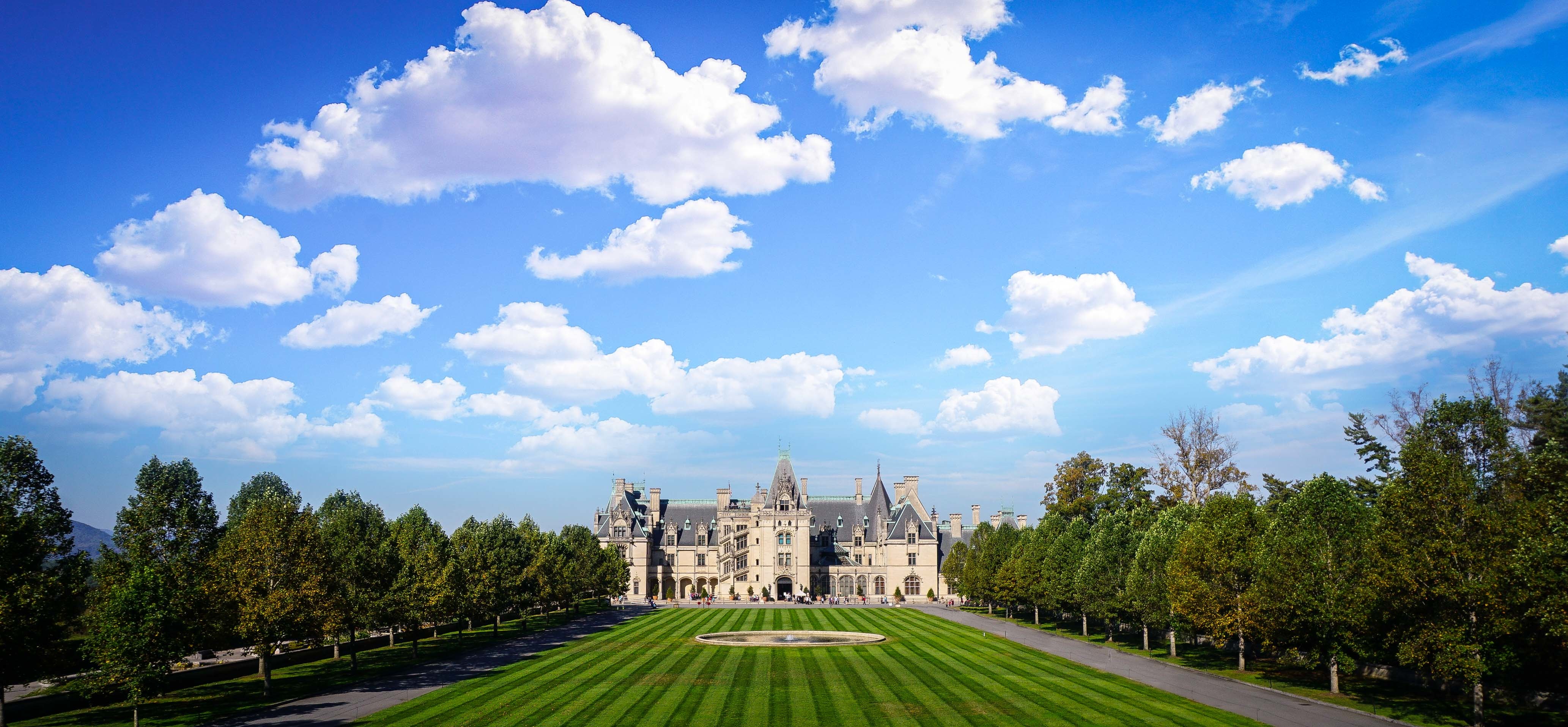 The Biltmore Estate under a partially cloudy sky