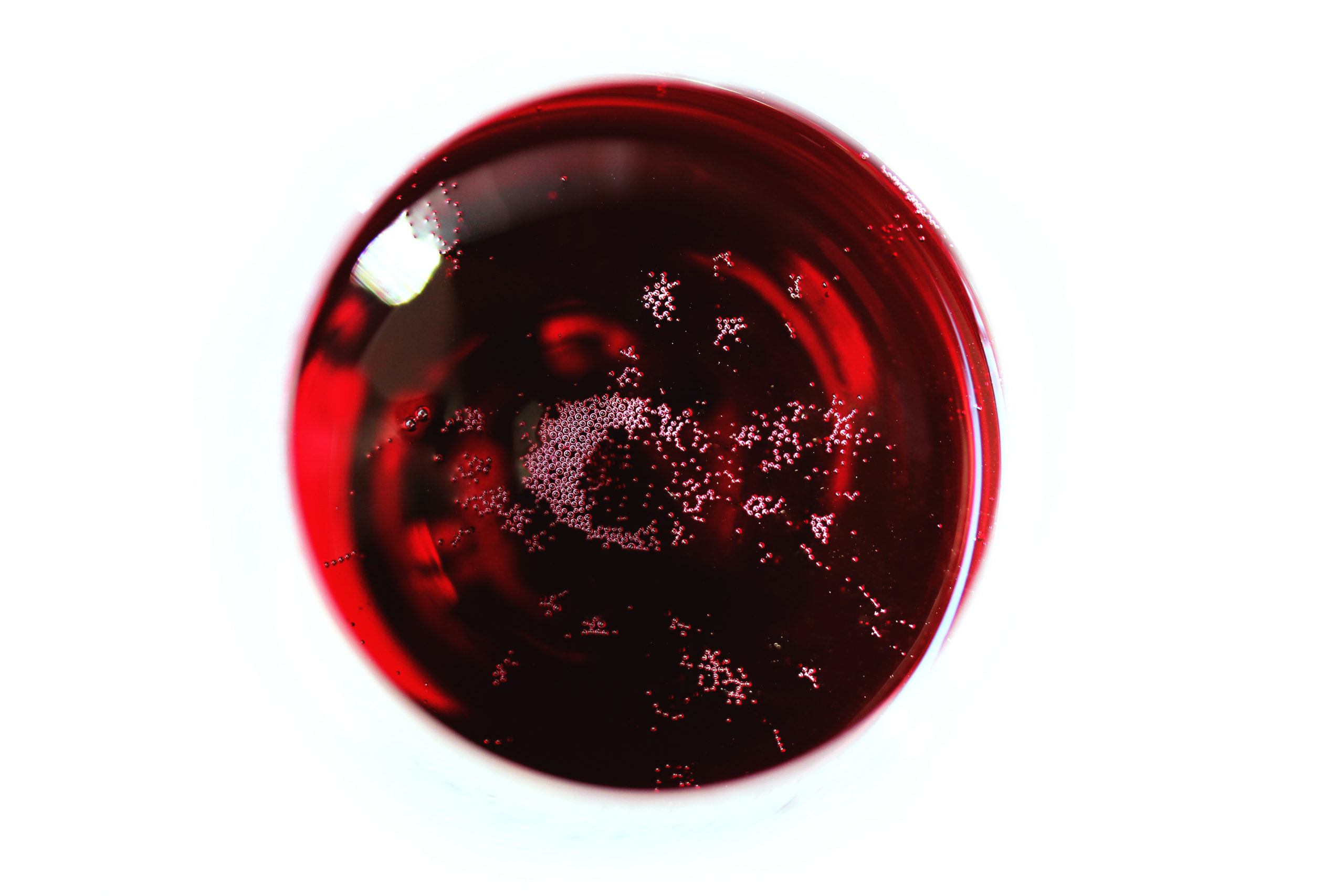 Red Lambrusco wine glass viewed from above